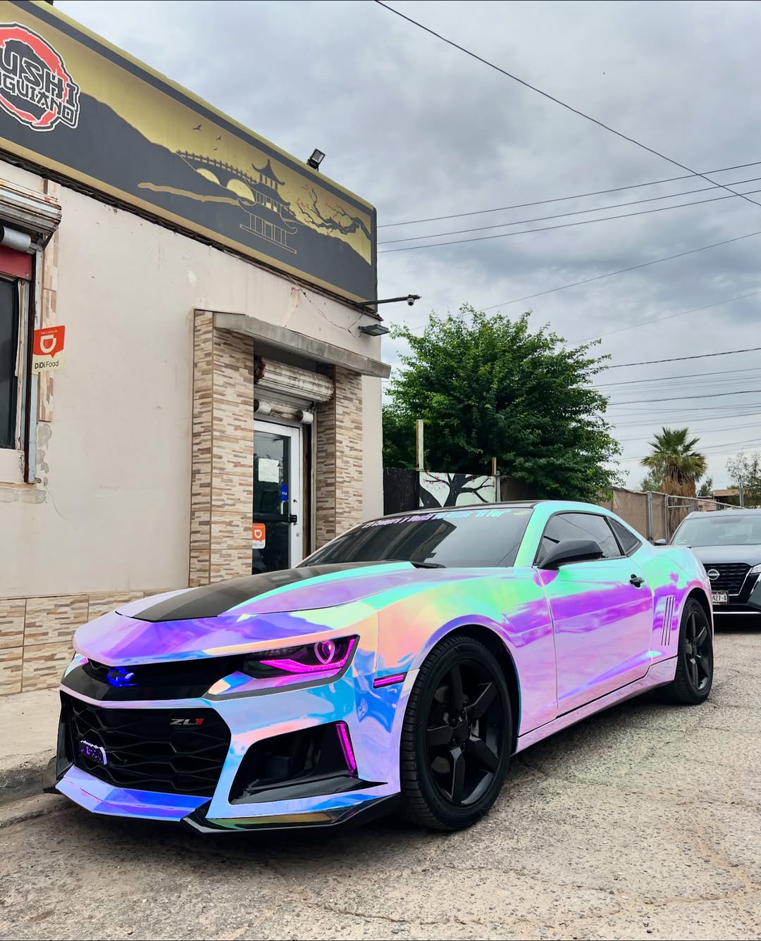Mirror Rainbow Chrome White Vinyl Wrap installed on Chevrolet Camaro ZL1 (sixth generation) Camaro ZL1 (sixth generation)
