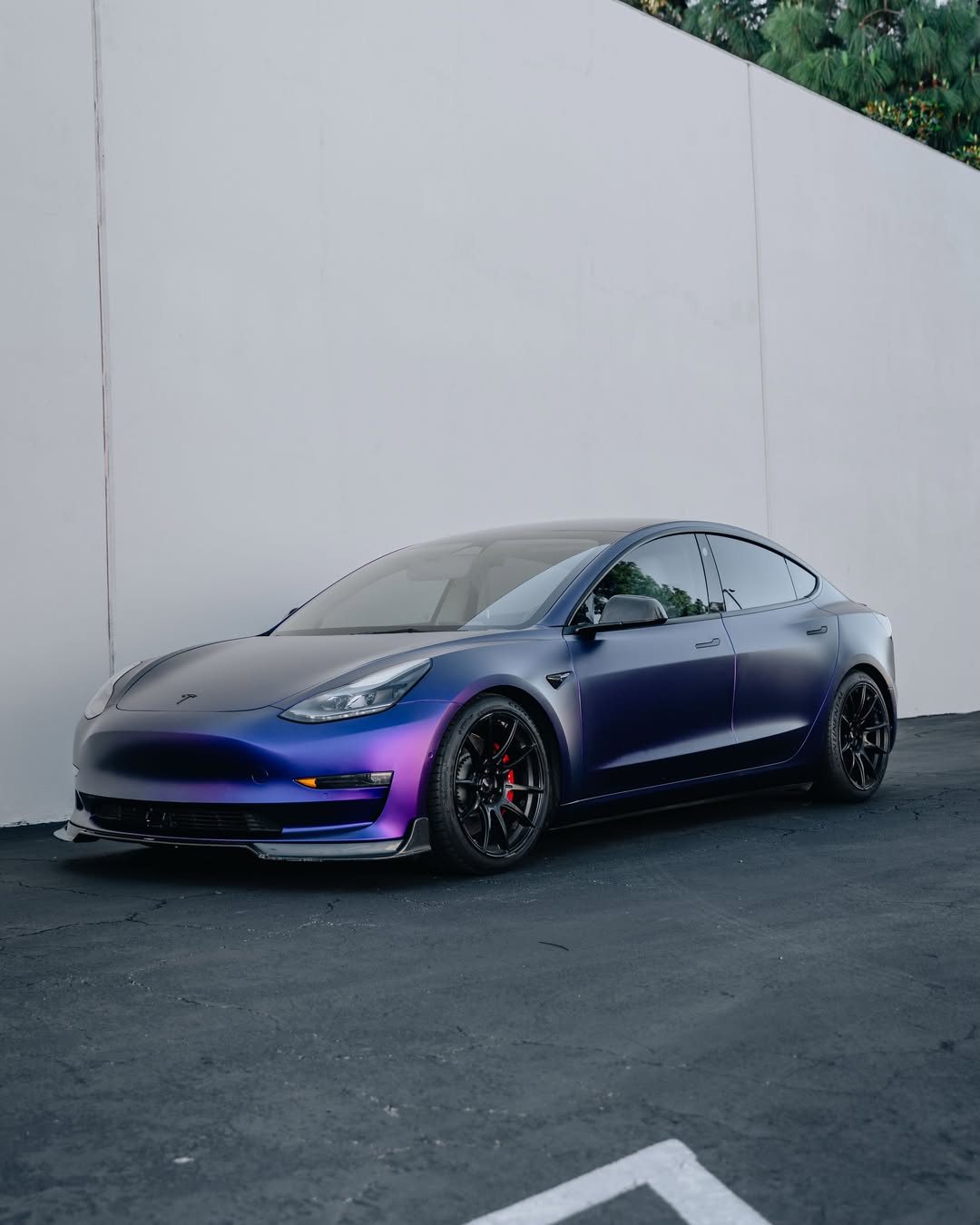 Satin Pearl Metal Purple Vinyl Wrap installed on Tesla Model 3 Model 3